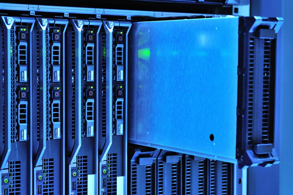 pexels-photo-17489153-17489153 Detailed view of server racks with glowing lights in a data center environment.